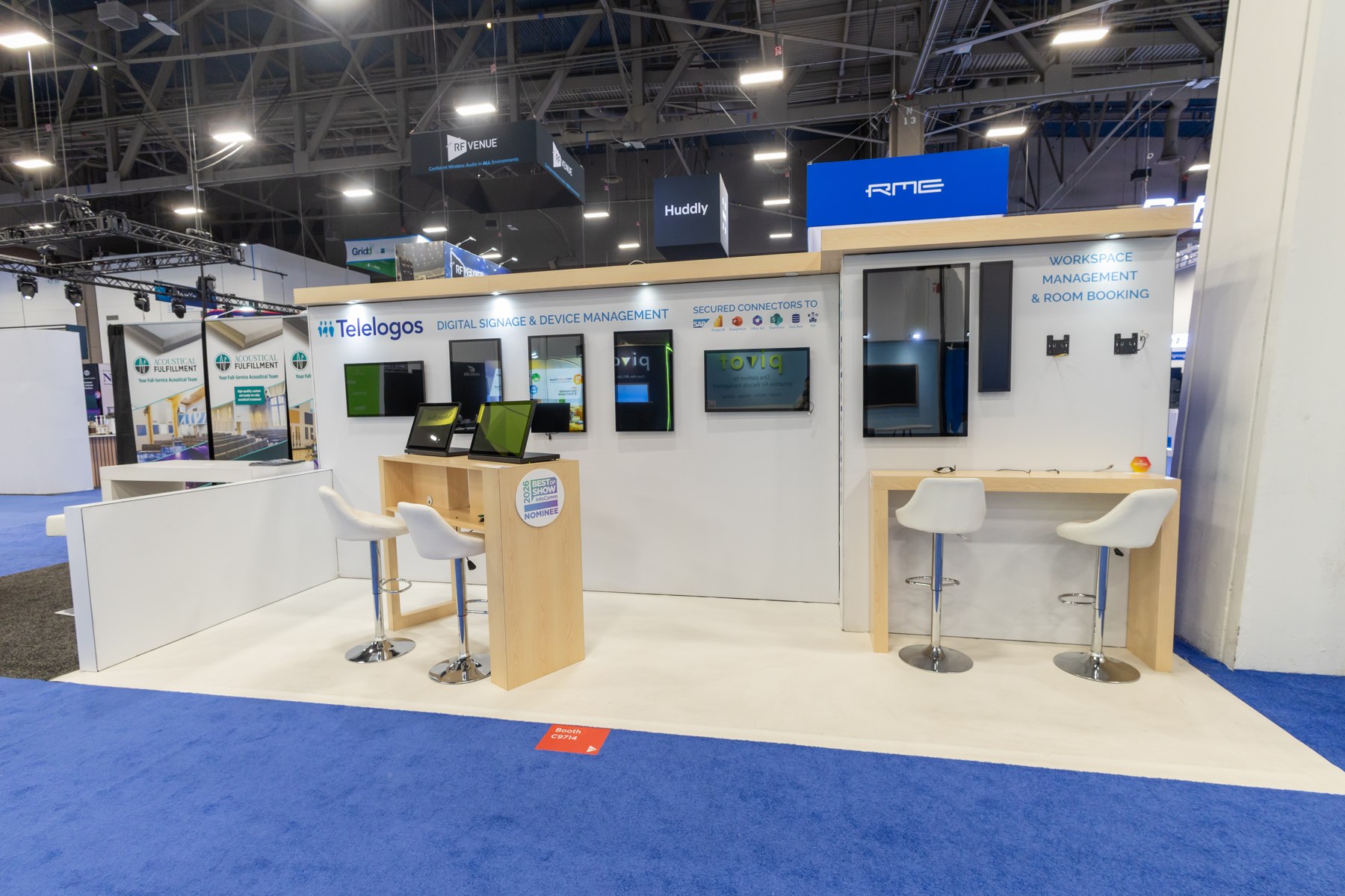 White and blue exhibition booth with demonstration screens
